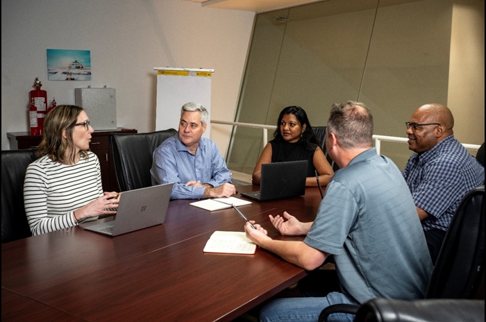 Safiyahh (center) at one of Firetrace’s Board meetings.