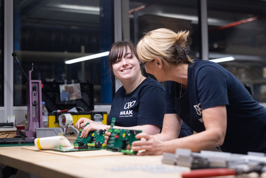 two female limotec employees smiling